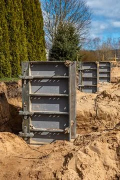 Construction Site with Metal Framework Panels and Trenches Stock Photos