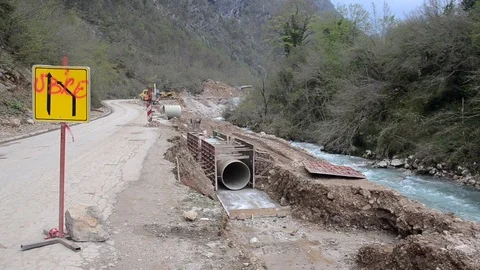 Construction site of a micro hydro power plant. Building dam on river Stock Footage