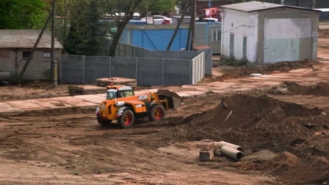 Construction site, mini excavator working on a construction site Stock Footage 241943830