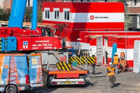 Construction site with mobile crane, storage containers and crew wagons Stock Illustration