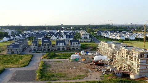 Construction Site of a Modern Apartment Building in Front of a New Housing Area. Stock Footage 274428016