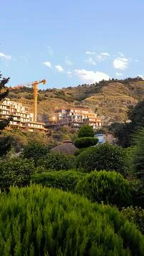 Construction Site of Modern Residential Complex on Green Mountain Hill. Stock Photos