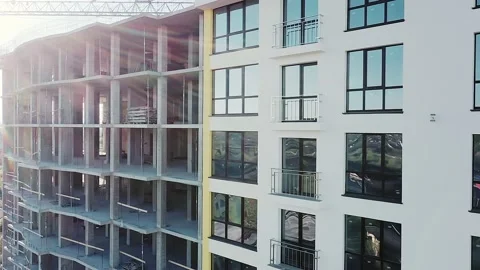 Construction site with monolith frames of new multi story buildings in fast-grow Stock Footage 165384584