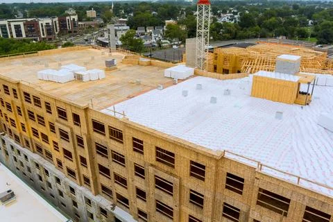 Construction site new building framework materials in city setting Stock Photos