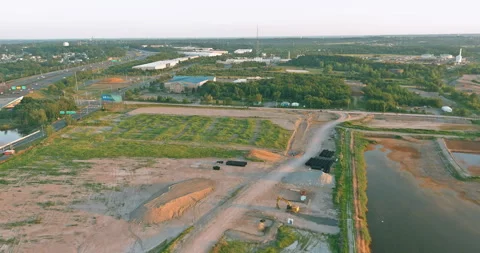 Construction site with new development area beside highway, river in an Video stock 339013290