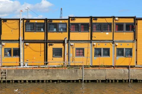 Construction site office - portable container housing at a workplace. Stock Photos