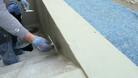 Construction site - plastering a balustrade wall Видео 250658644