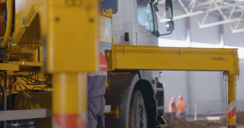 At a construction site, a powerful mobile crane is preparing to lift a load Stock Footage 161950629