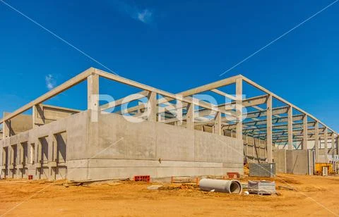 Construction site with precast concrete columns, beams and walls ~ Hi ...