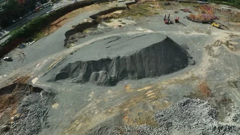 Construction site progress featuring earthworks and machinery in urban Stock Footage 316450771