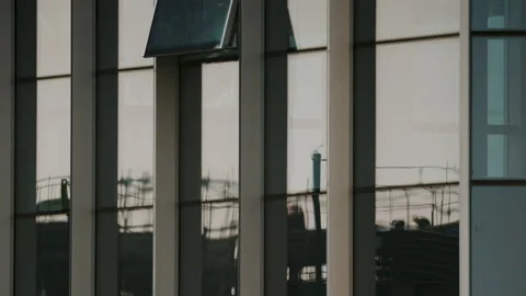 Construction Site Reflected In Window Stock Footage 224325124