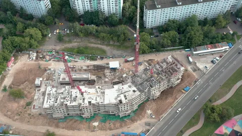 Construction site in residential area. Two cranes on project. Start of building. Stock Footage 139806167
