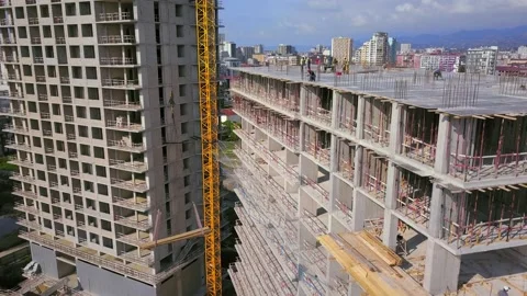 Construction site of residential building with workers. monolithic construction. 스톡 동영상 205374898