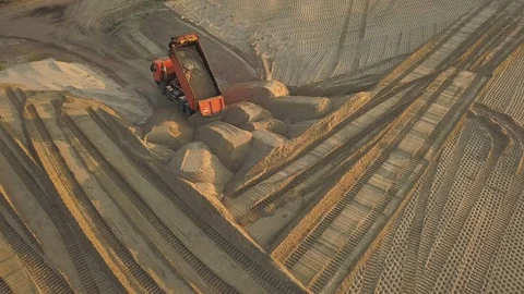 Construction site on the road construction site. Dump trucks with sand  Stock Footage 111769334