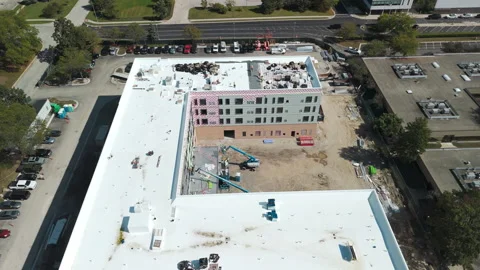 Construction site rooftop covered with bright white insulation, waterproofing Stock Footage 319728516