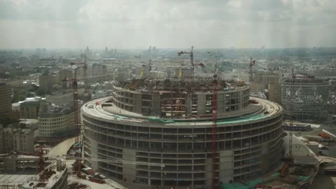 The construction site of a round-shaped stadium in the center of a megapolis Video stock 259061778
