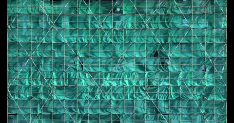 Construction site safety netting sways in the wind Stock Footage 294476188