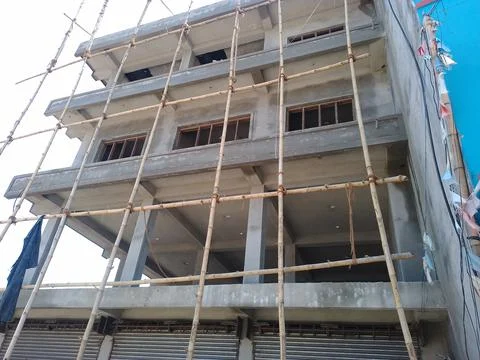 Construction site with scaffolding on building. Stock Photos