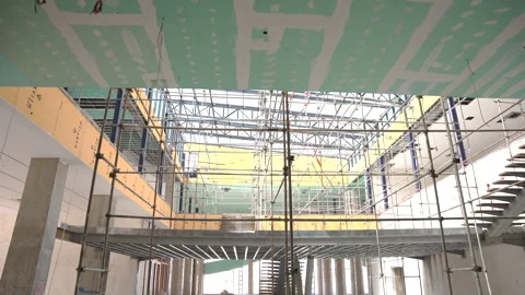 Construction site with scaffolding inside modern building Stock Footage 316233409