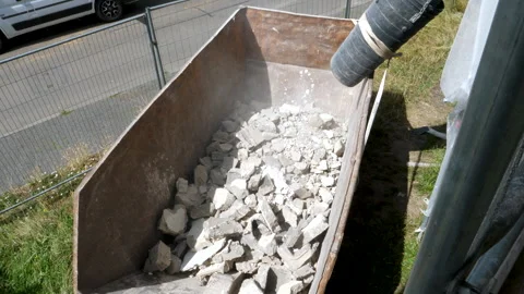 Construction site - scaffolding, rubble chute and debris container Видео 247996520