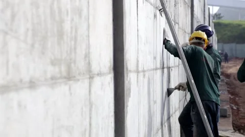 Construction site scraping wall Stock Footage 153549837