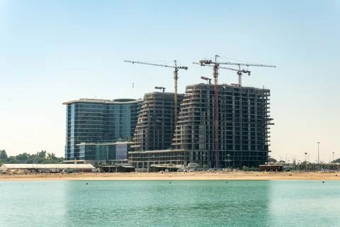 Construction site on the seashore. Concept - erection of buildings in the coa Stock Photos