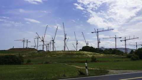 A construction site with several cranes Stock Photos