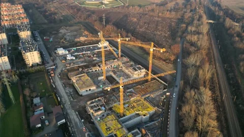 Construction site showcasing cranes and ongoing building activities Видео 347789946