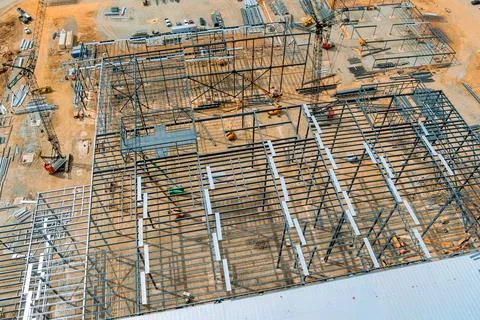 Construction site showcasing metal framework of large building in progress Stock Photos