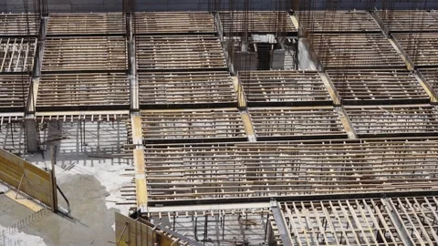 Construction site showcasing the structural framework of buildings under deve Stock Footage 304355156