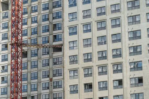 Construction site showing a building under development with a crane on a wa.. 写真素材