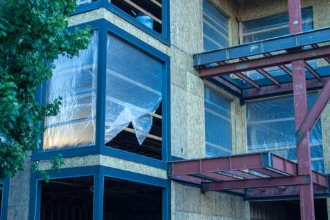 Construction site showing frame of structure. Closeup of window. Sun beam. Stock Photos
