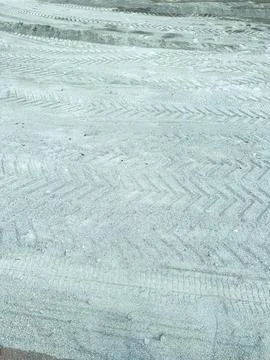 Construction site showing freshly leveled ground with tire tracks from mach.. Stock Photos