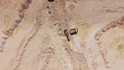 Construction site showing machinery at work on a dirt field Stock Footage 341327888