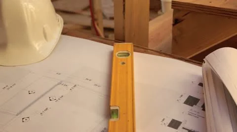 Construction site showing plans and hardhats. Stock Footage 11821115