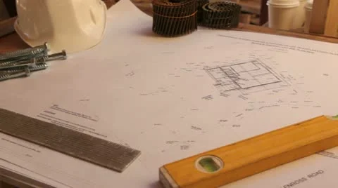 Construction site showing plans and hardhats. Stock Footage 11821243