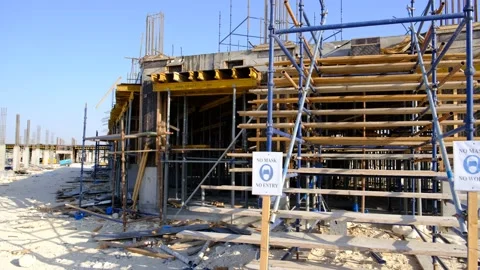 Construction site showing warning sign, not to enter site without mask. Video stock 135155009
