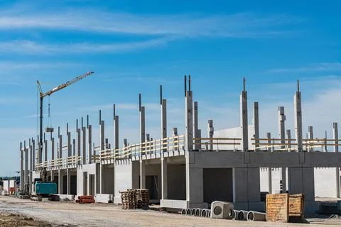 Construction site shows building process in sunny weather Фото