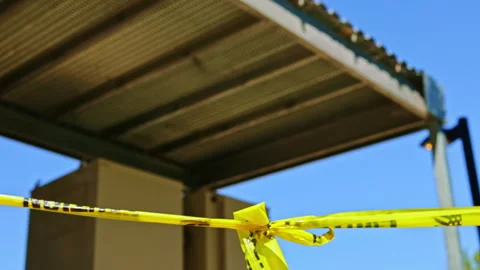 Construction site shows caution tape tied on a barrier with a shelter structure Stock Footage 334156789