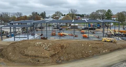 Construction Site Shows Metal Structure Being Built in a Small Town Area Du.. 库存照片
