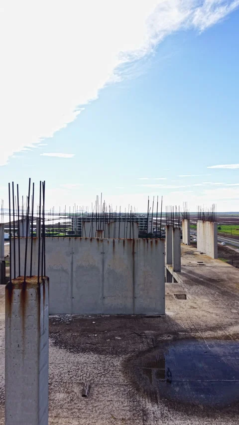 Construction site shows raw beauty of unfinished urban landscape under a bright Stock Footage 332052126