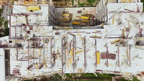 Construction site shows unfinished building with materials scattered across the Stock Footage 340135177