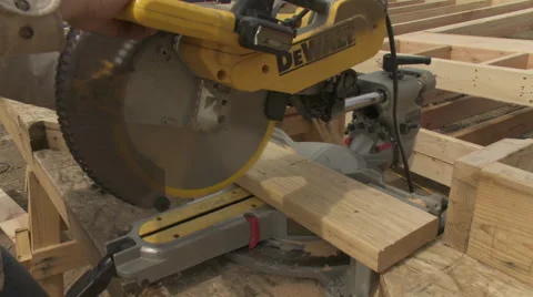 Construction site, single cut with a miter saw MCU Stock Footage 47376460