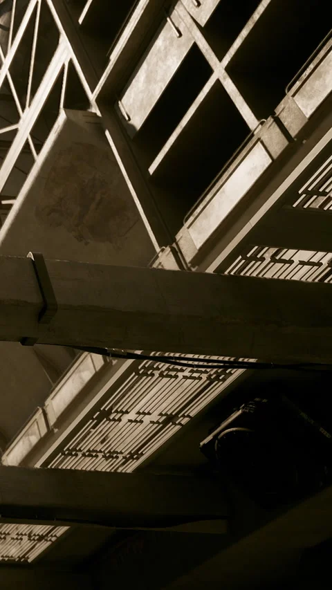 Construction site with solid beams and shadows in urban area during daylight Vídeos de archivo 335693381