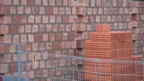 Construction Site with Stack of Red Clay Cinderblock Bricks  Stock Footage 327763804