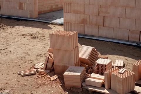 Construction site with stacked clay bricks Stock Photos