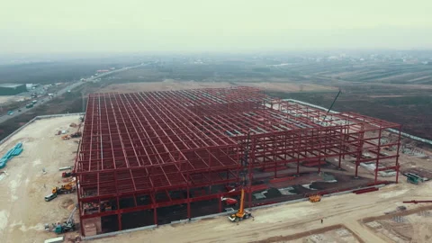 Construction site of steel frame structure, aerial back fly. Beams without roof Video stock 168646477