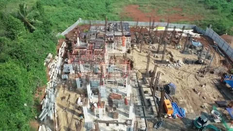 Construction Site with Steel Framework and Concrete Base Among Trees Stock Footage 318379078