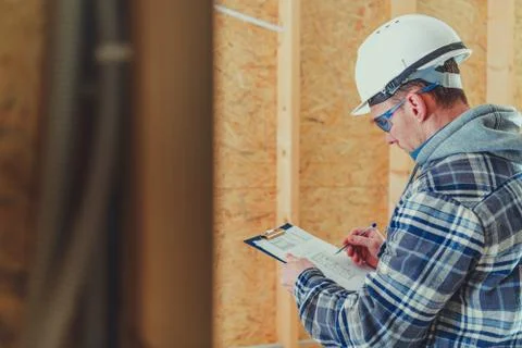 Construction Site Supervisor Engineer Making Proper Documentation on a Site. 库存照片