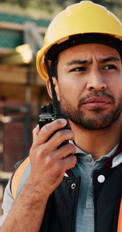 Construction site, talking and man with radio for communication, feedback and Stock Footage 336242143